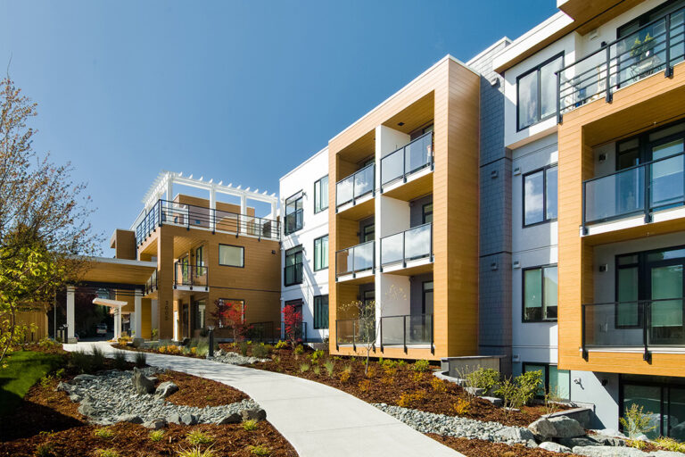 Artisan WoodGrain - Wood look Fiber Cement Siding and Soffit - Mahogany Kiwanis Cook Street Apartments